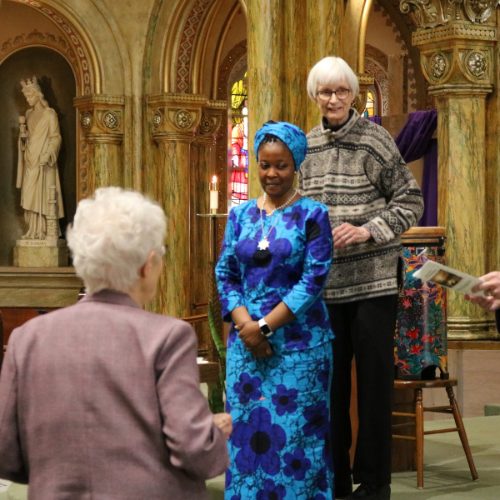 Sister Nina places FSPA medal oround Sister Clara Abisola's neck