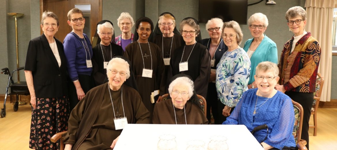 a group photo of 14 catholic sisters