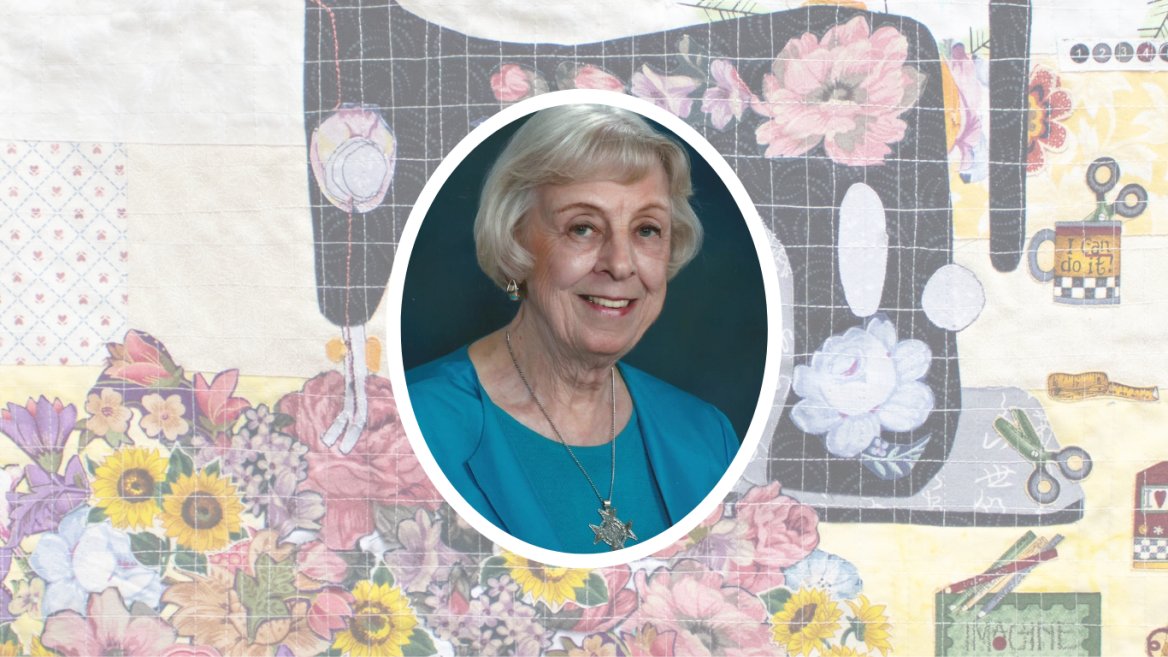 patchwork-quilt-with-flowers-and-black-sewing-machine-and-orval-portrait-of-gray-haired-woman-in-teal-blouse-and-silver-medal